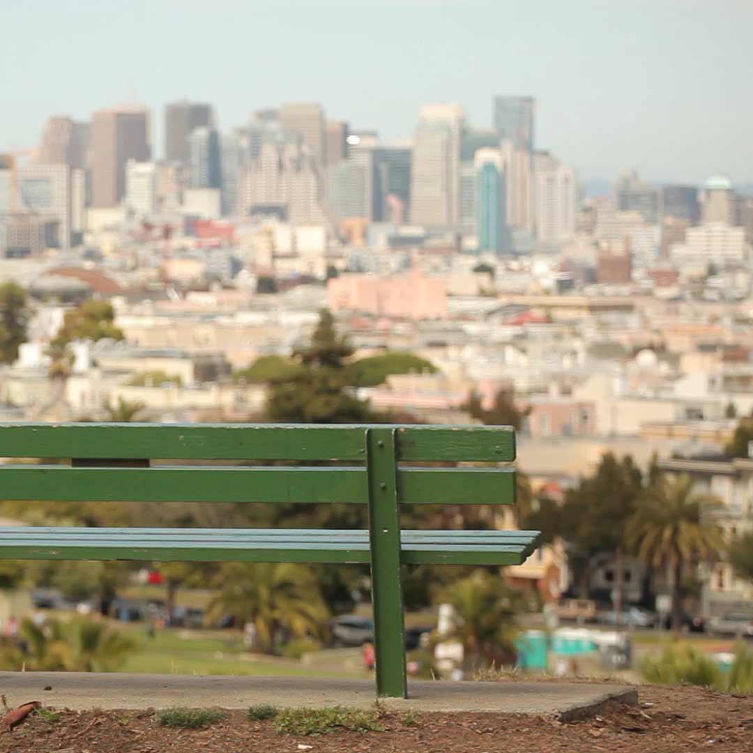 A bench overlooking Dolores Park